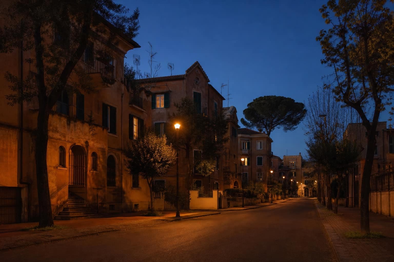 Strada della Garbatella al crepuscolo, lampioni accesi